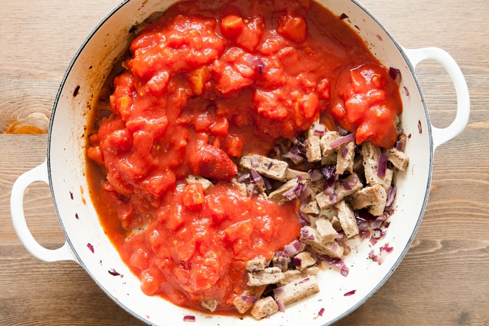 Add tomatoes to the Quorn pasta bake mix