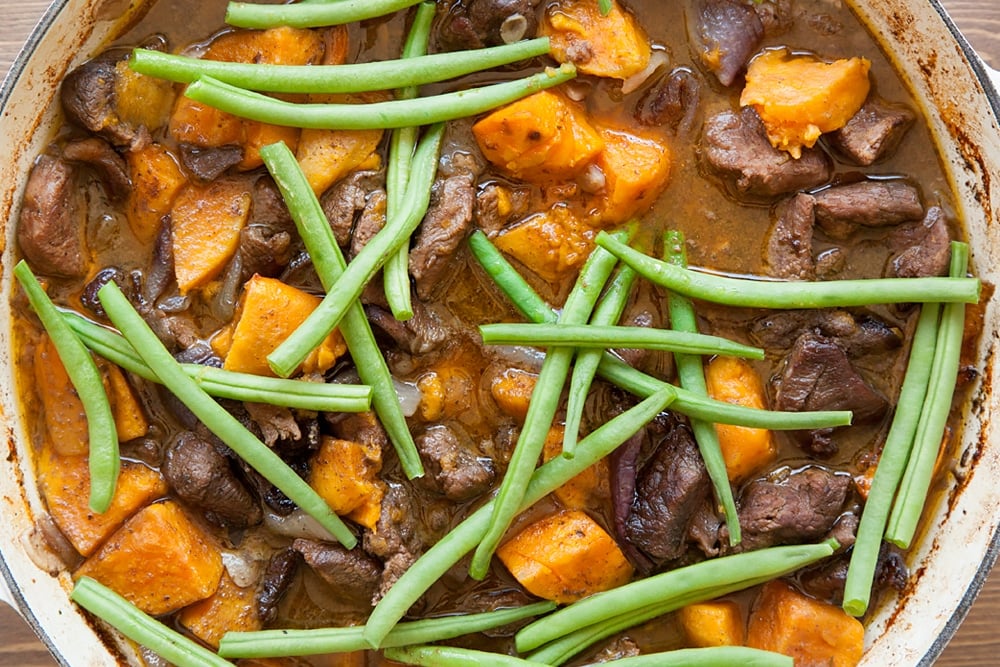 Add green beans to the slow cooked lamb and sweet potato casserole