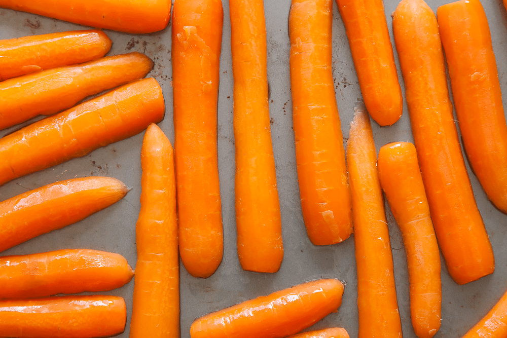 Sliced carrots on a baking tray