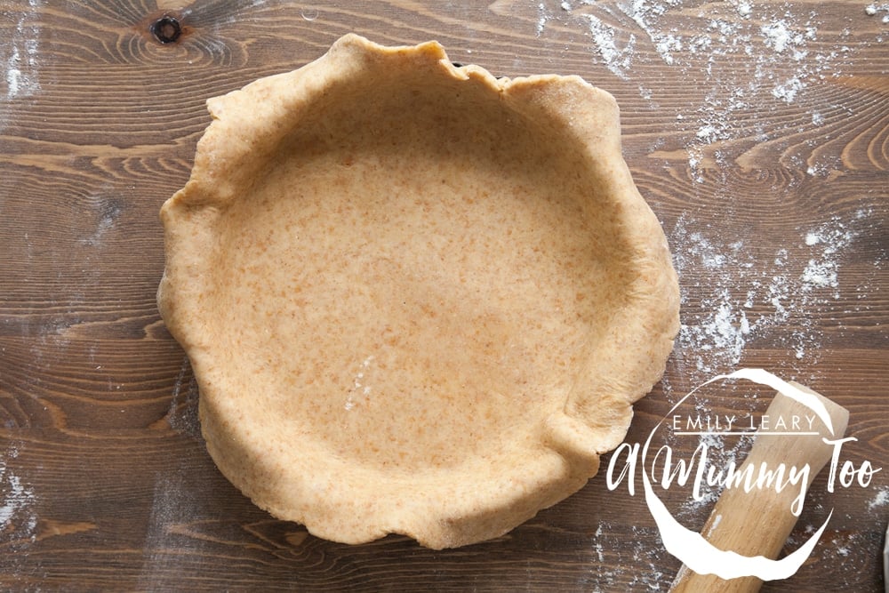 Creating the quiche using pastry and a quiche tin
