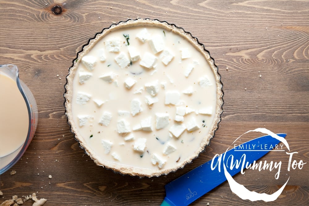 Pour the egg mix over and put your mushroom, spinach and feta quiche into the oven