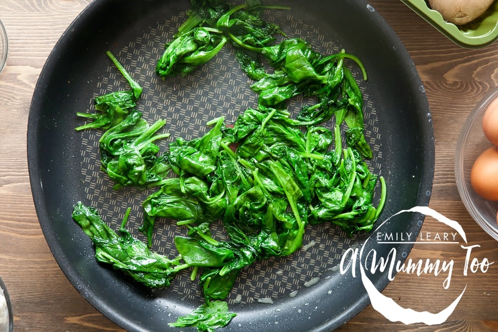 Frying spinach until gently wilted