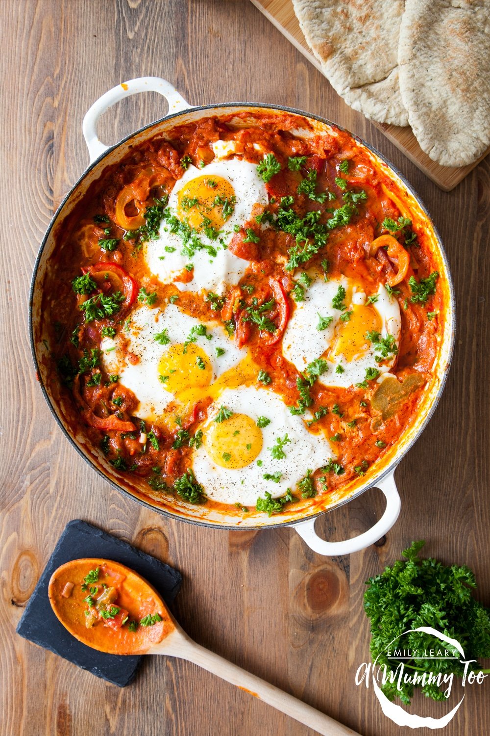 Baked eggs in a spicy tomato bake in a casserole dish