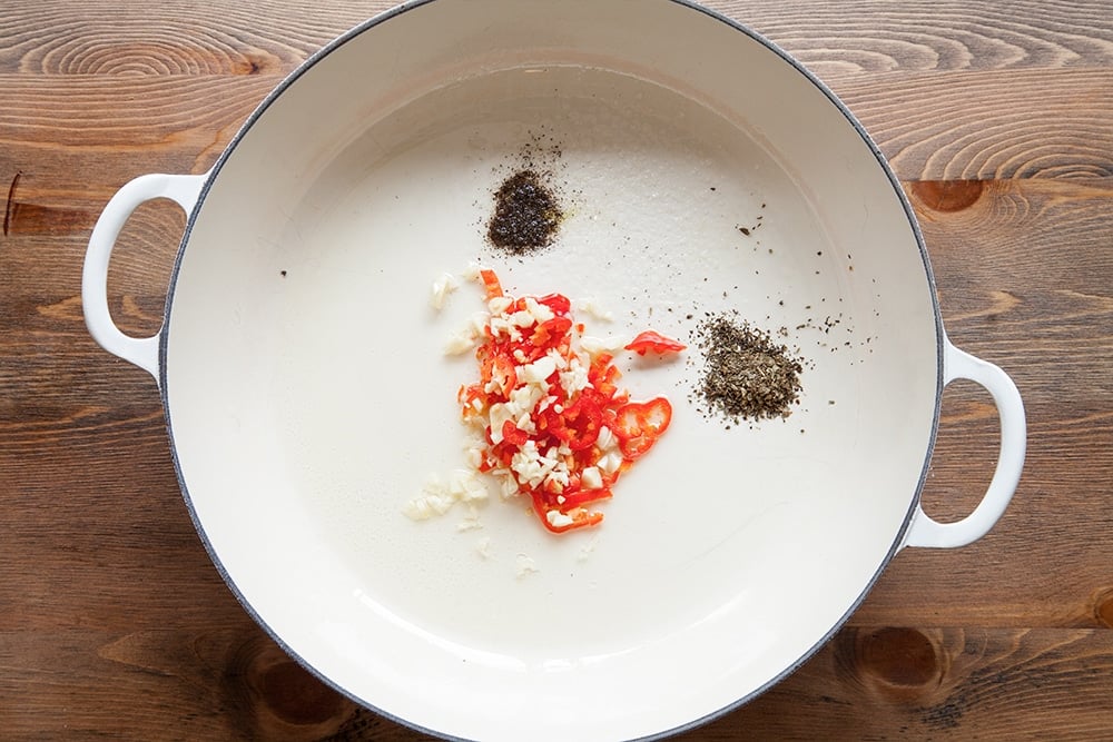 Overhead shot of Ingredients in a frying pan for the spicy tomato sauce