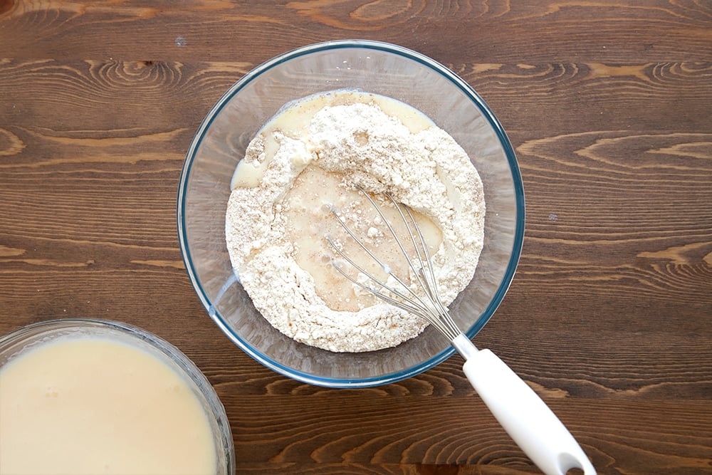 Combining the dry and wet ingredients for the waffle mix