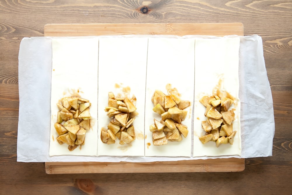 Assembling the apple and granola puff parcels