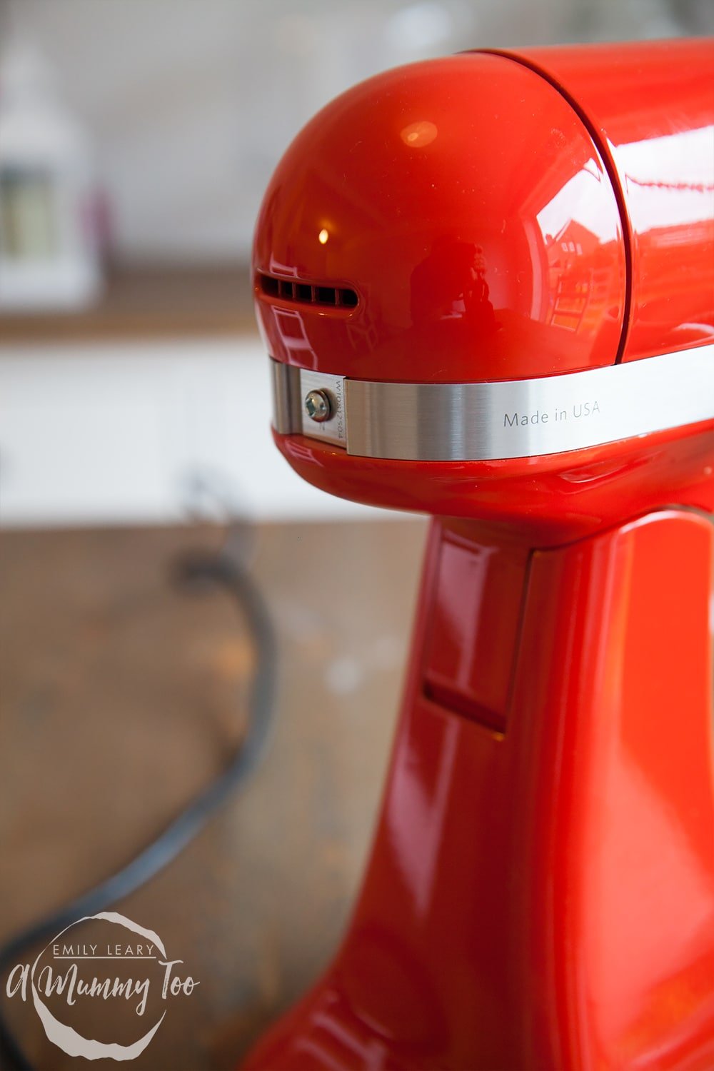 Close up of the red KitchenAid Mini with the engraving 'Made in USA' on the side. 