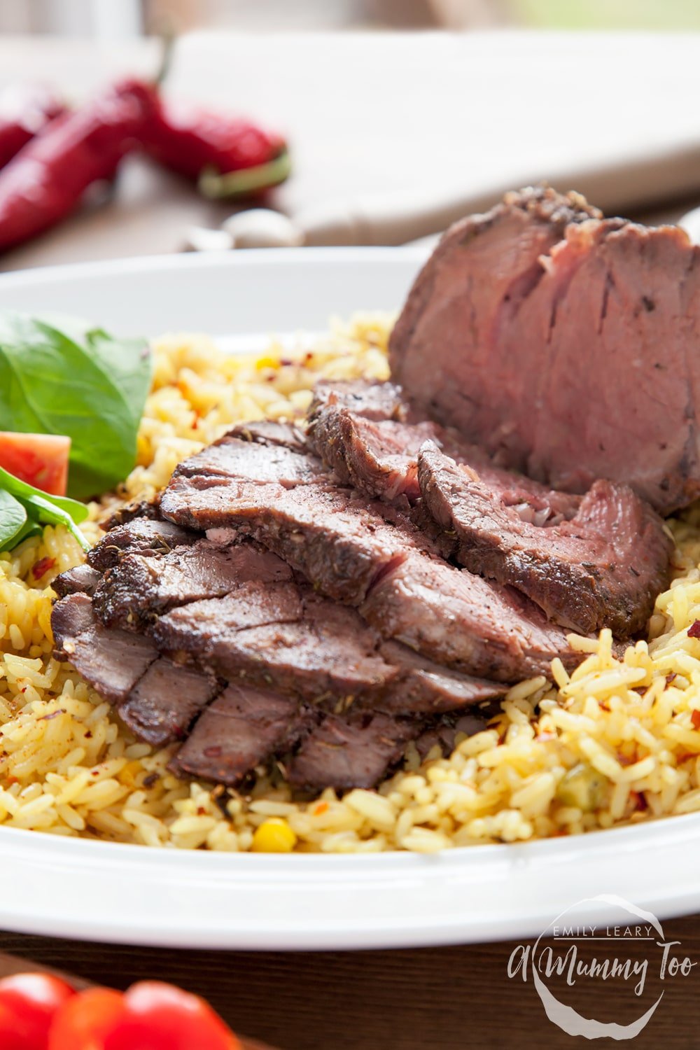 Piri piri beef mini roast served with vegetable rice and a green side salad