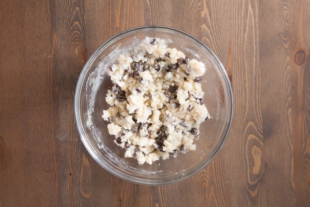 Mixing the ingredients together to create gluten-free chocolate chip cookies