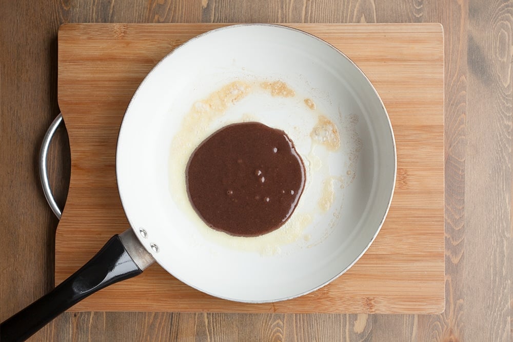 Frying a black forest pancake in a frying pan