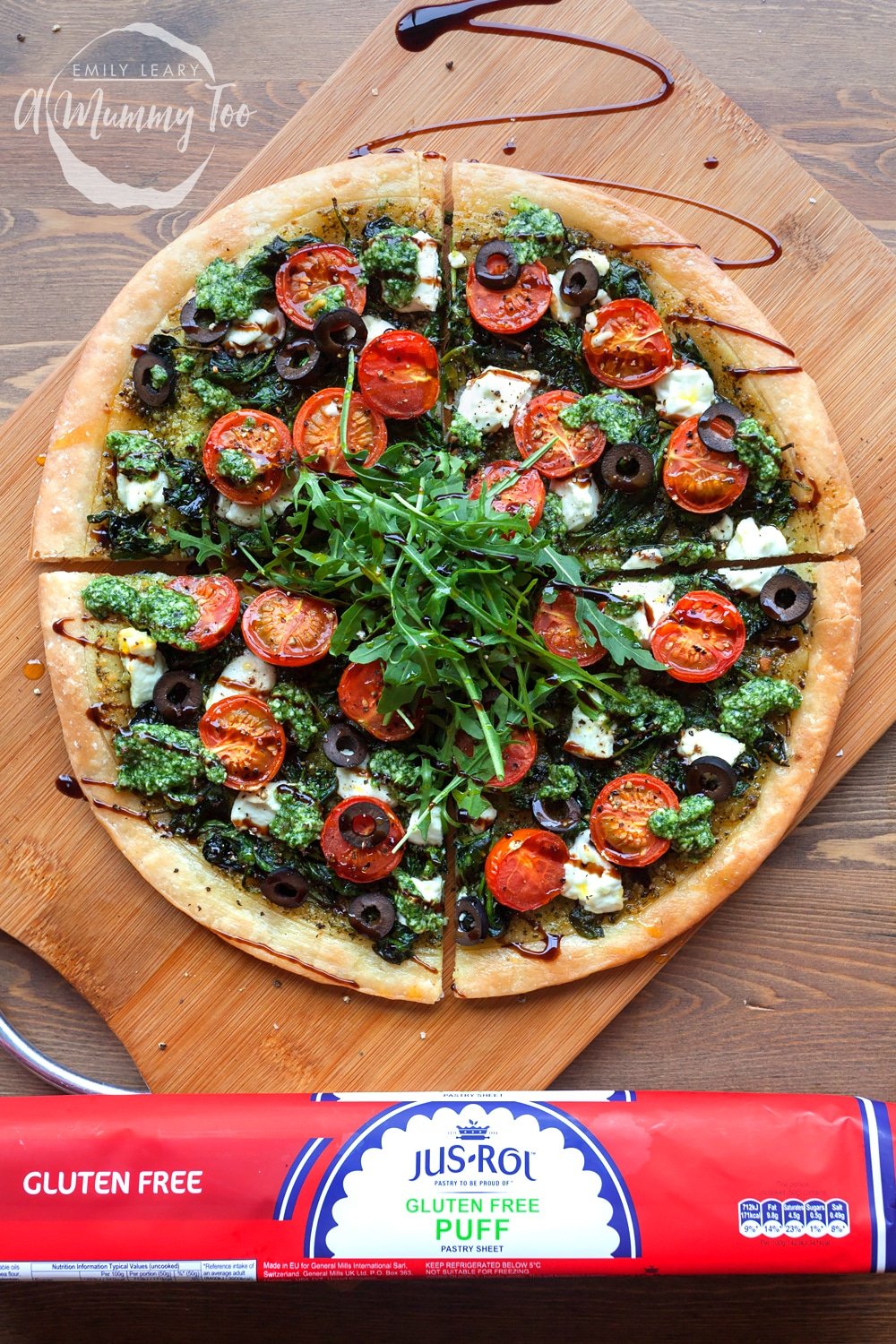 Serve your gluten-free spinach and goat's cheese pesto tart with sliced olives, rocket and a drizzle of balsamic glaze
