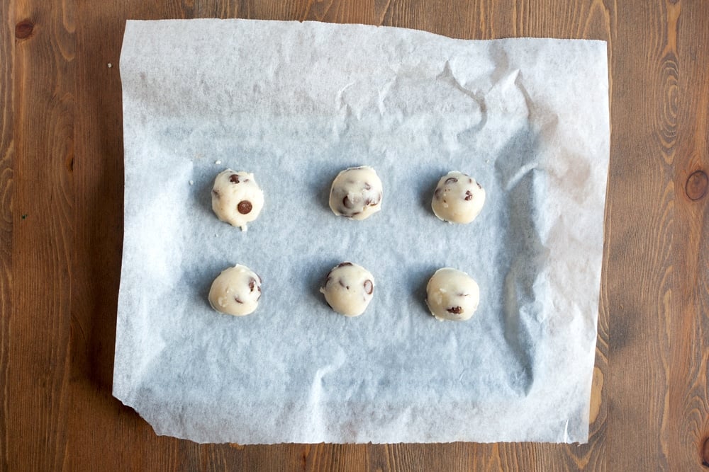 Preparing the chocolate chip cookies for baking