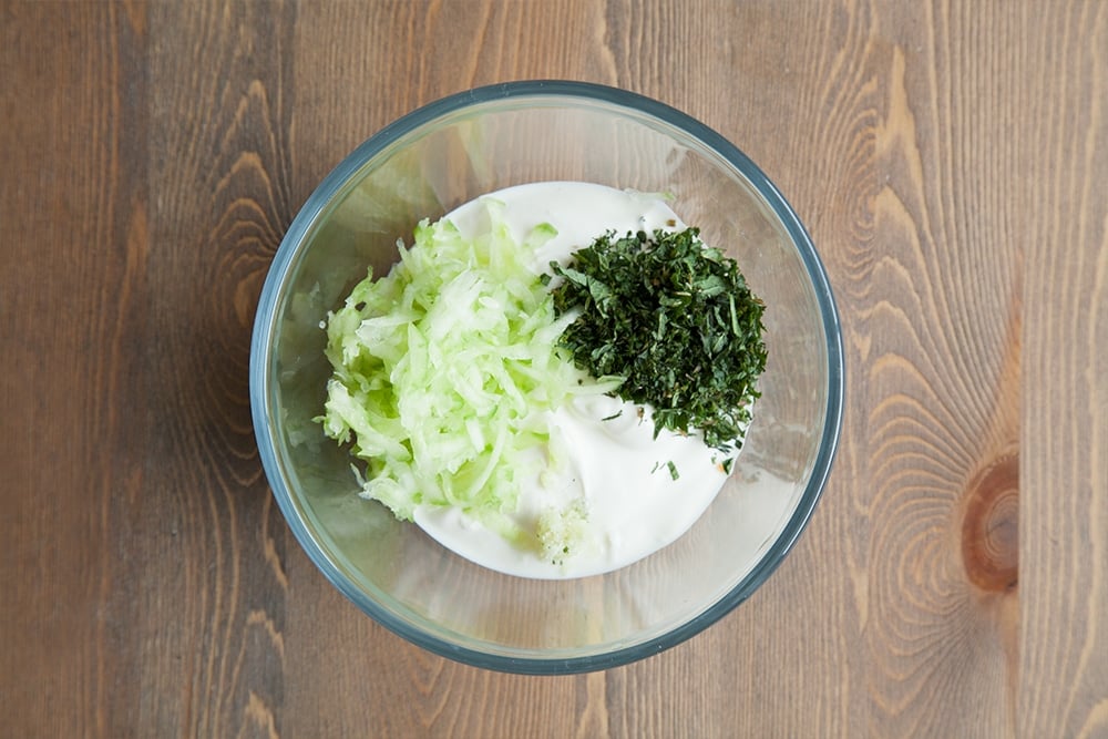 Chopped mint, garlic and yogurt are used to create the dip
