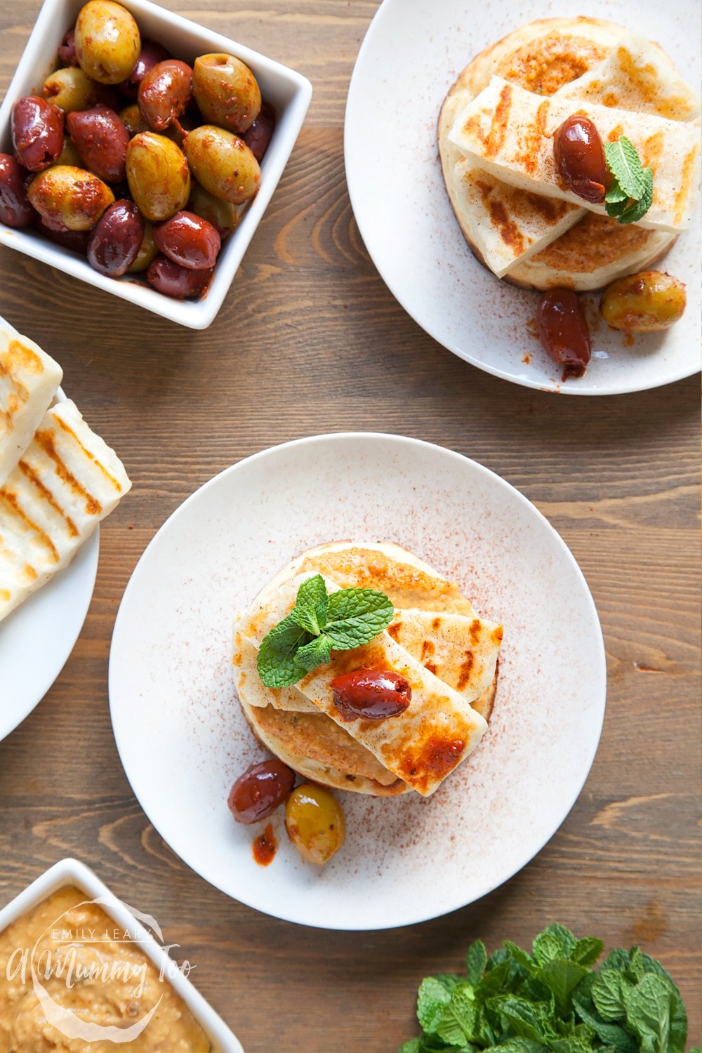 Finish your gluten-free meze-inspired crumpets with a topping of harissa olives and mint leaves!
