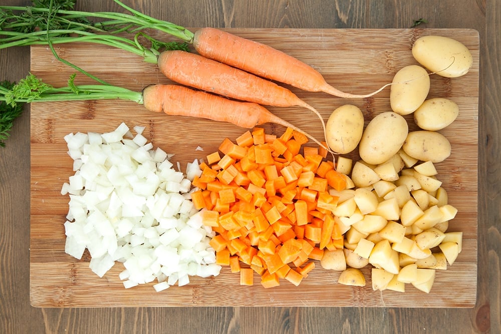 Vegetables prepared on a chopping board, ready to make the curry