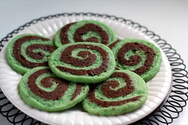 Chocolate Pistachio Pinwheel Cookies by butter with a side of bread