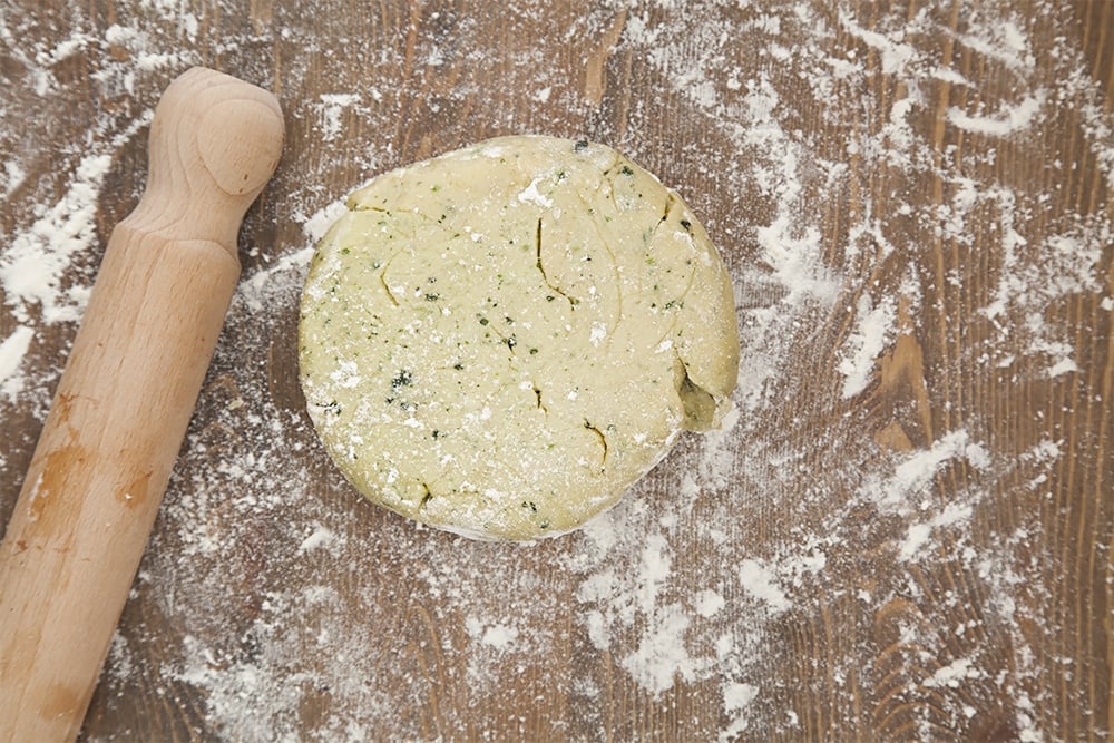 Rolling out the basil infused pastry to create the pie