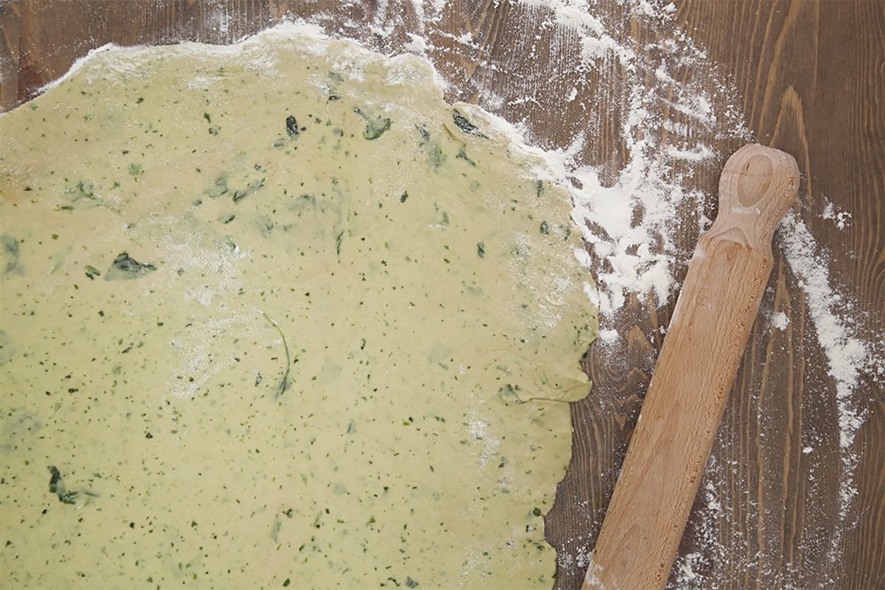 Rolling out the basil infused pastry to create the pie