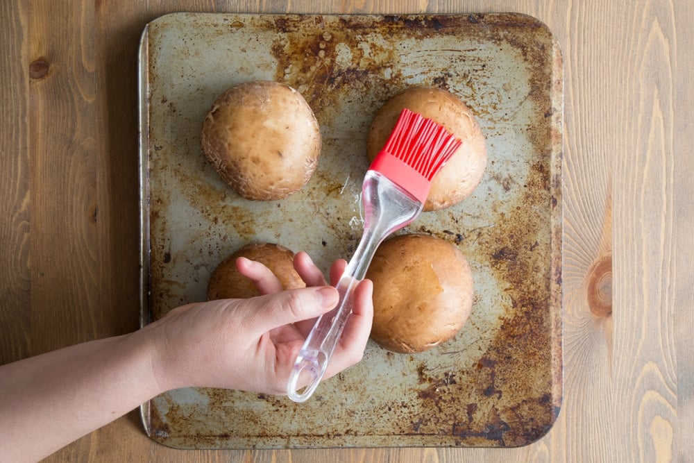 Preparing the portobello mushrooms for baking