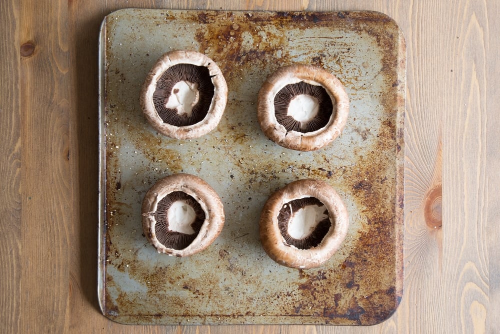 Preparing the portobello mushrooms for baking