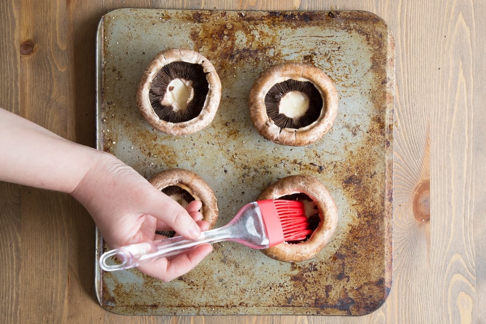 Prepare the portobello mushrooms with oil before baking