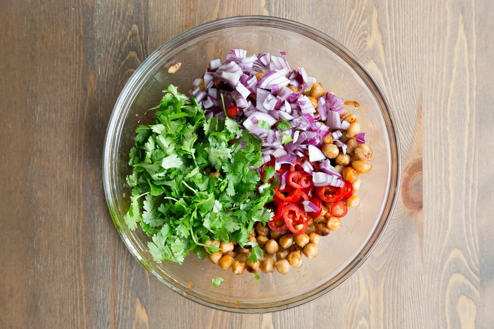 Chili, onion and coriander are added to your BBQ chickpeas