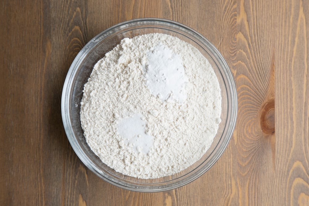 Flour, baking powder and salt (the dry ingredients for your tortillas) mixed in a bowl
