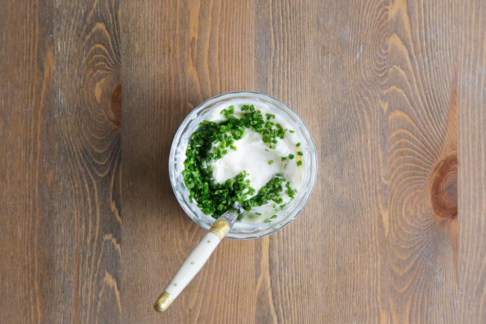 Make a dressing to accompany your summer BBQ chickpea wraps with sour cream, chives and lemon juice