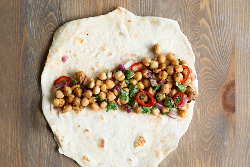 Assemble your summer BBQ chickpea wraps by adding 1/8 of the mixture to your tortilla wrap