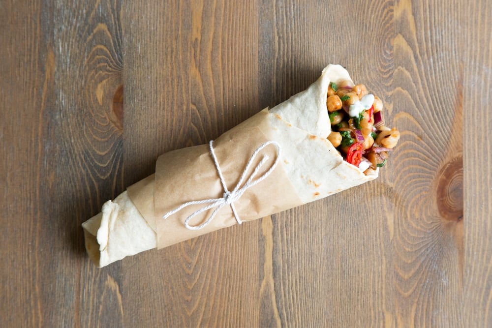 Finish your summer BBQ chickpea wraps by wrapping in greaseproof parchment, tie with string and serve to your BBQ guests