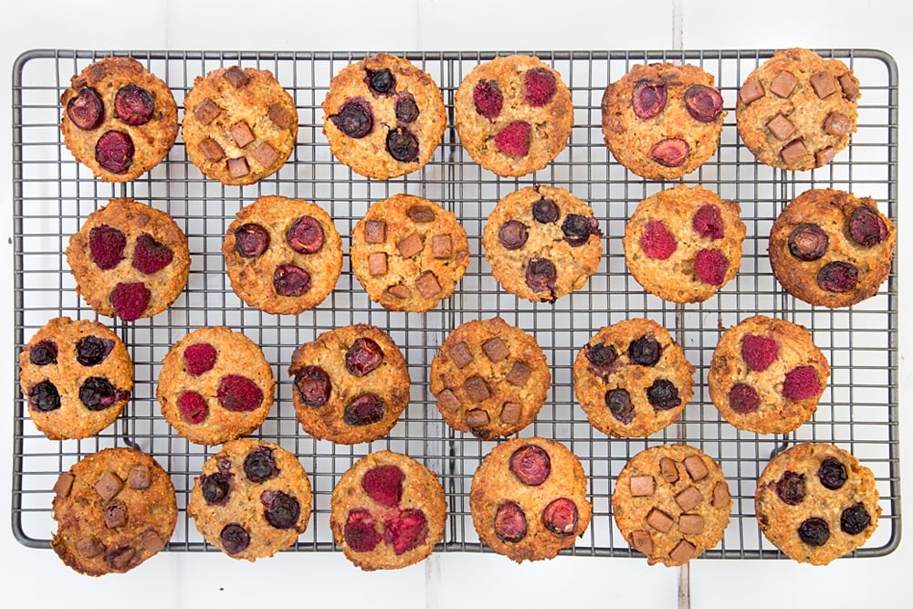 Yummy yogurty summer fruits breakfast muffins cooling on a wire rack. Soon they'll be ready to enjoy at breakfast, or packed away for a school lunch or picnic