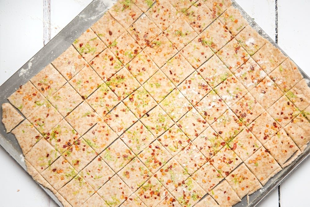 Slicing the lime and chilli cracker dough into crackers