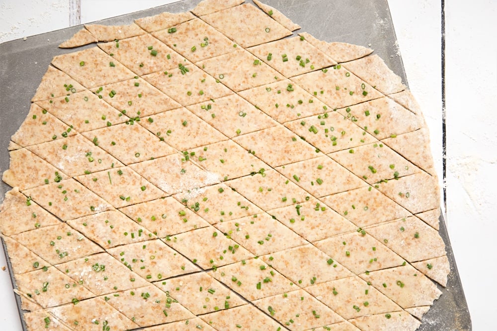 Gruyère and chive crackers on a baking tray, ready to be baked