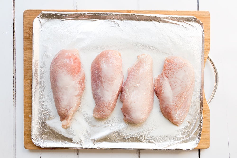 Preparing the chicken breasts for roasting