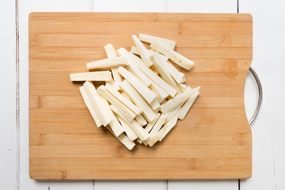 Sliced parsnips become fries to accompany the herby baked chicken
