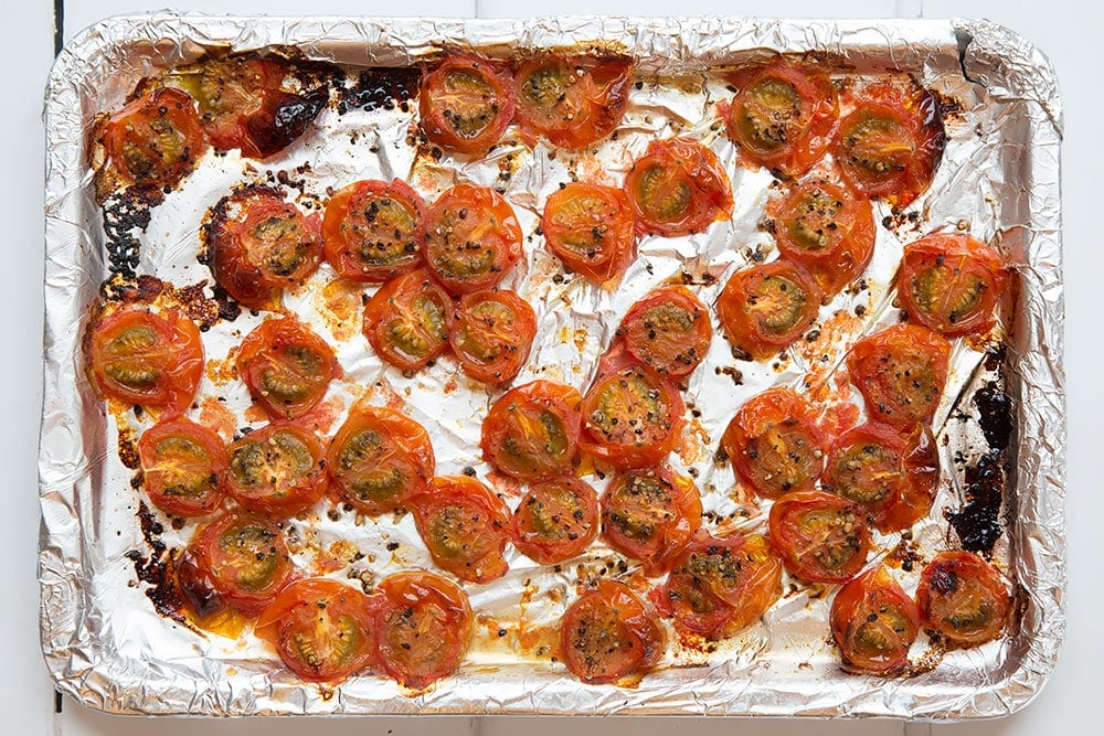 Baking cherry tomatoes to add to the black spaghetti and tomato sauce