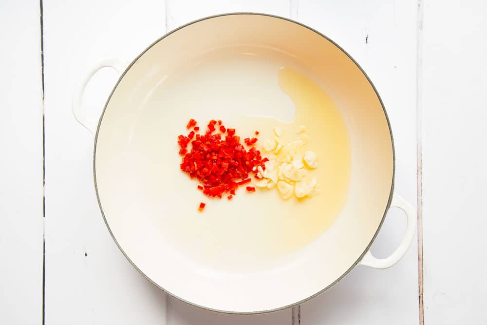 Garlic and chilli, one of the first steps in creating this red lentil penne alla puttanesca