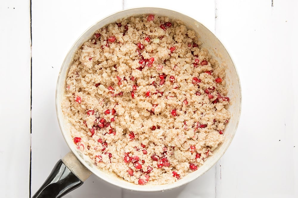 Pomegranate seeds are stirred into the cauliflower 'couscous'