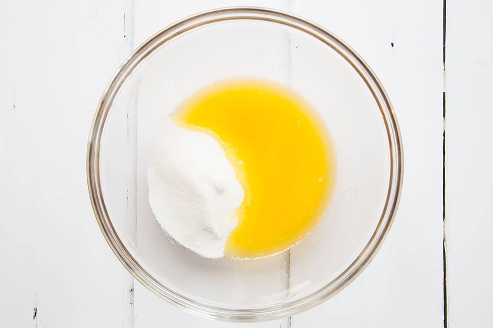 Butter and sugar are melted together in a bowl