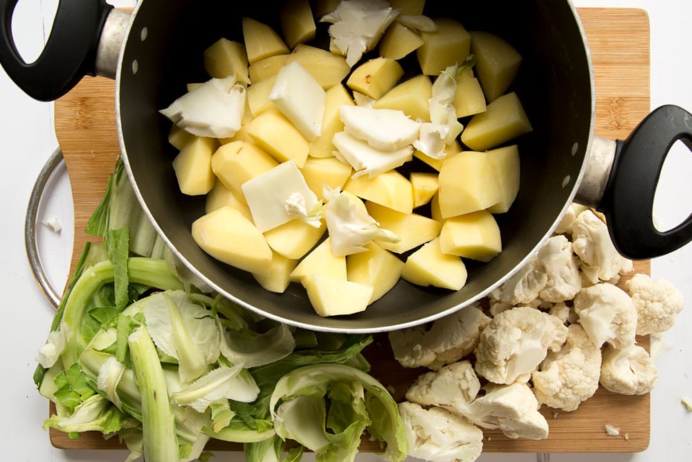 Preparing the potato and cauliflower root mash