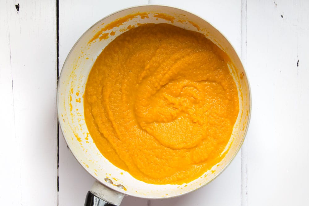 The fragrant Thai carrot and coconut soup is blended to an almost smooth consistency