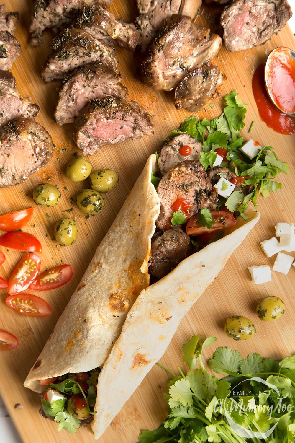 A herb crusted Welsh Lamb in a quick coriander flatbread wrap, shown alongside cooked lamb and salad