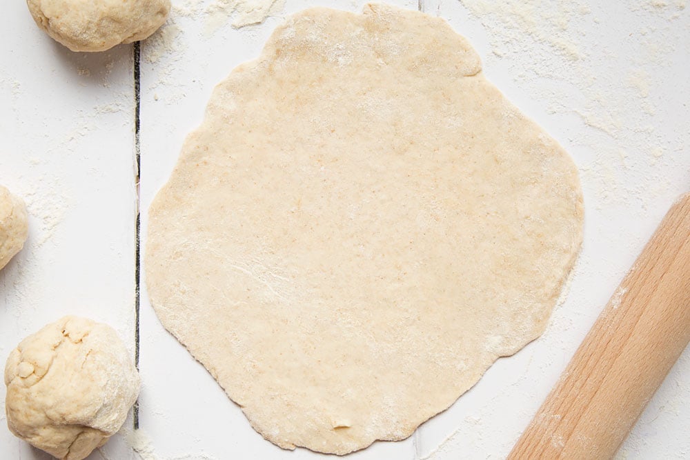 The dough ball, rolled out ready to shape the flatbreads