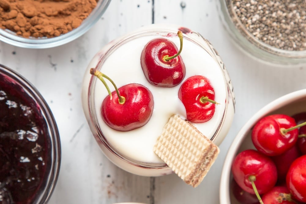 A wafer is added to finish the black forest breakfast jar