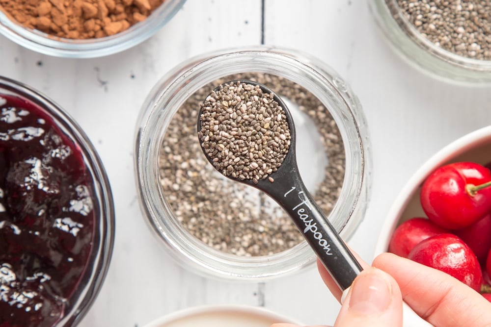 Chia seeds, shown on a measuring spoon