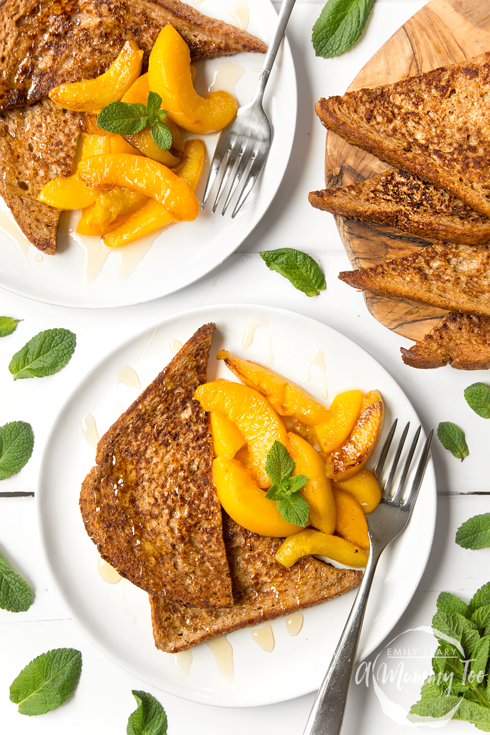 The finished cinnamon French toast with warm peaches, served with yogurt and honey