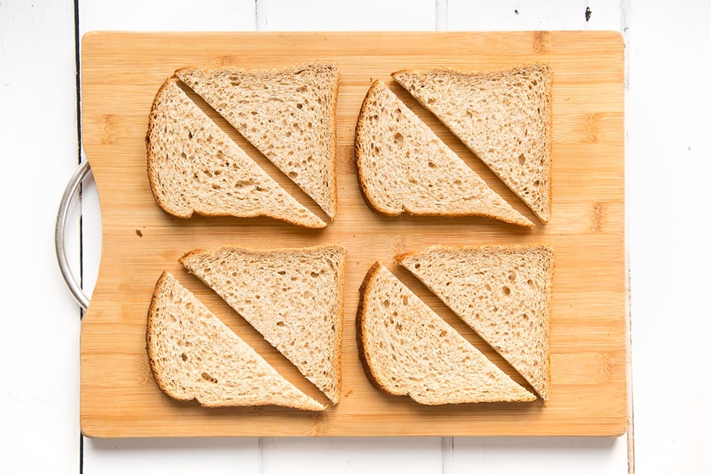 Sliced fresh bread, ready to be dipped into the egg mixture