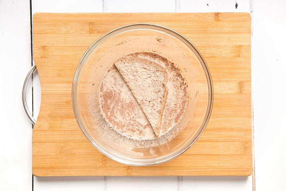 The bread is coated with the egg and cinnamon mix on both sides