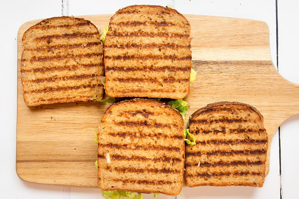 Assembling the deli-style corned beef on rye sandwich