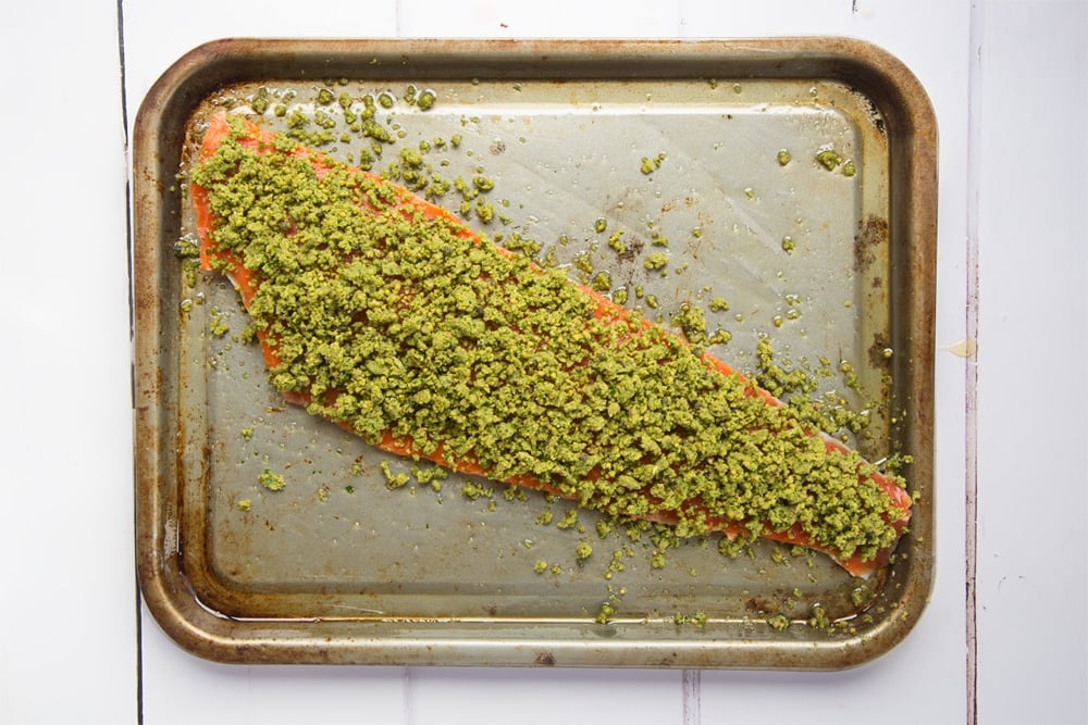 Prepare the Alaska salmon fillet by topping with the crumb